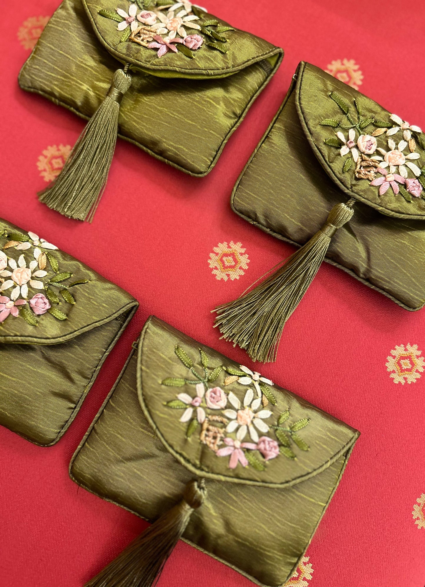 Bundle of 4 green silk traditional Chinese money pouches.