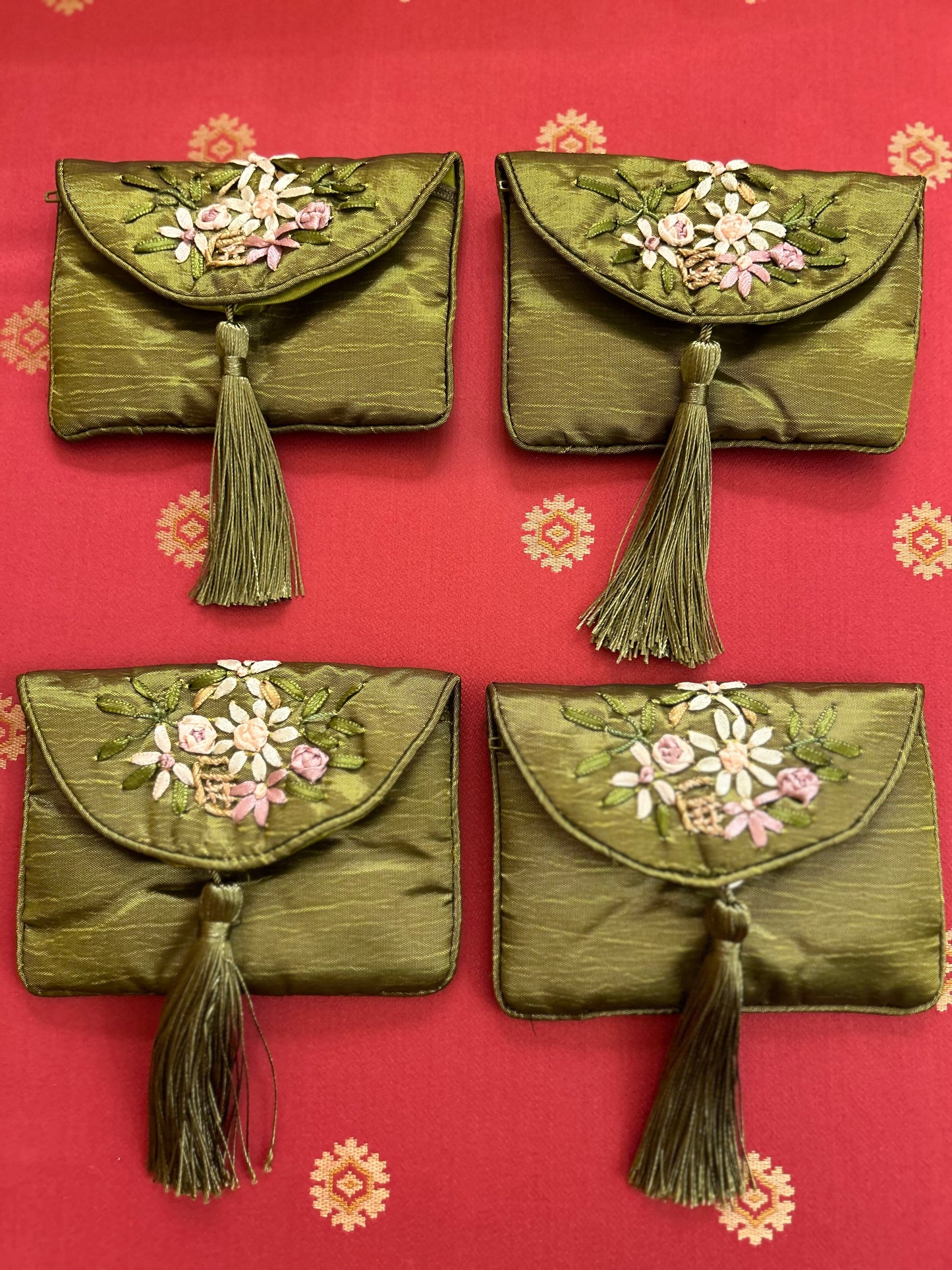 Bundle of 4 green silk traditional Chinese money pouches.
