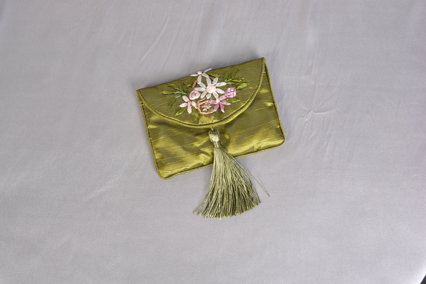 One piece green silk traditional Chinese money pouch.